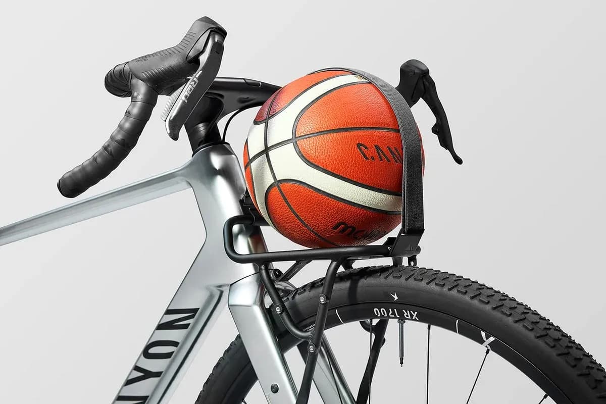 Basketball secured on bicycle rack with handlebars