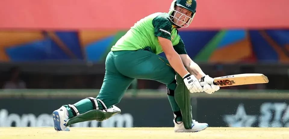 Batsman playing a shot on the cricket field