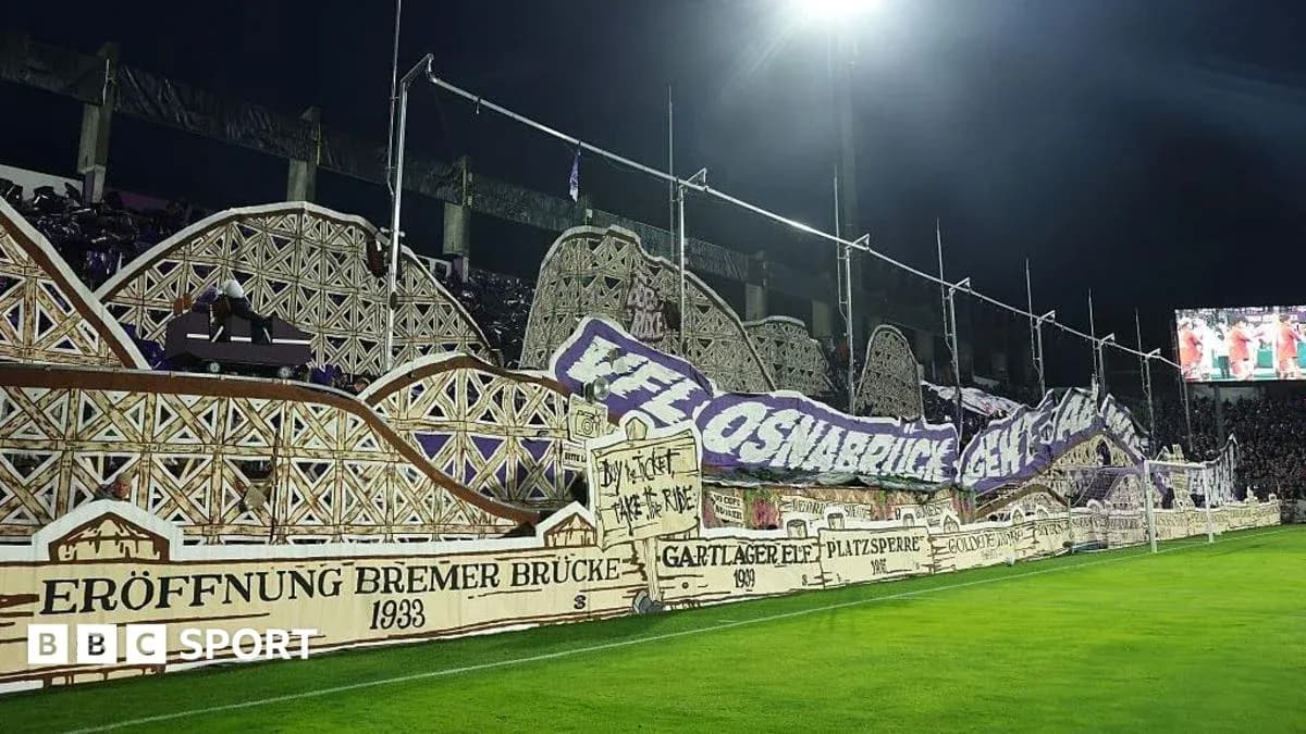 Large fan banner displayed in stadium during match
