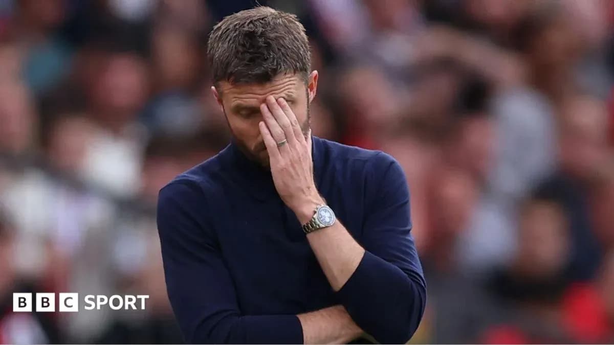 Coach with hand on forehead during match Coach with hand on forehead during match