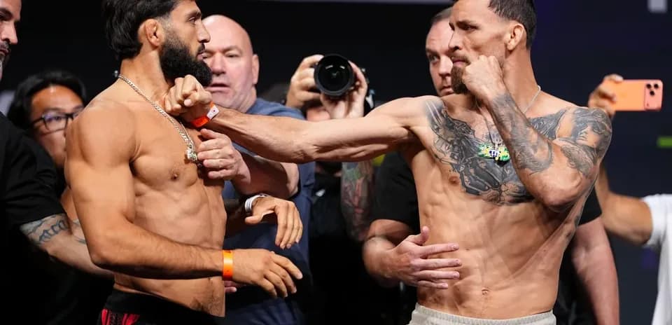 Two fighters facing off during weigh-in event
