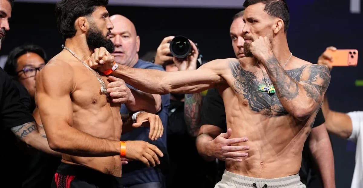 Two fighters facing off during weigh-in event