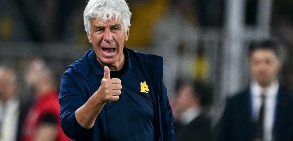 Coach giving a thumbs up during the match