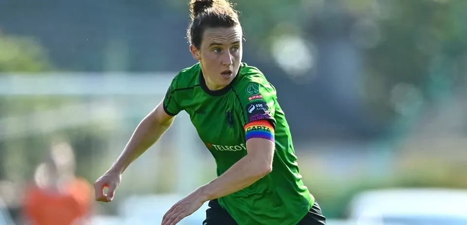 Player in green jersey running during a match
