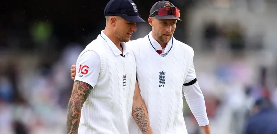 Two England players walking off the field together