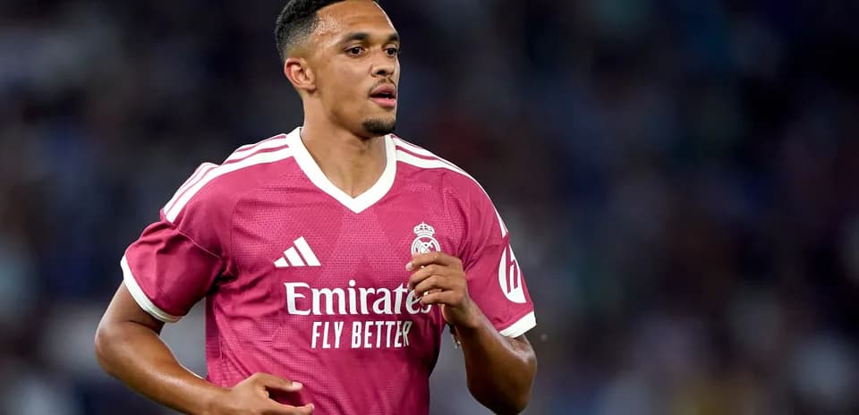 Player wearing pink Real Madrid jersey during match