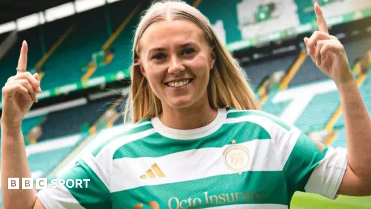 Player posing in Celtic jersey at stadium