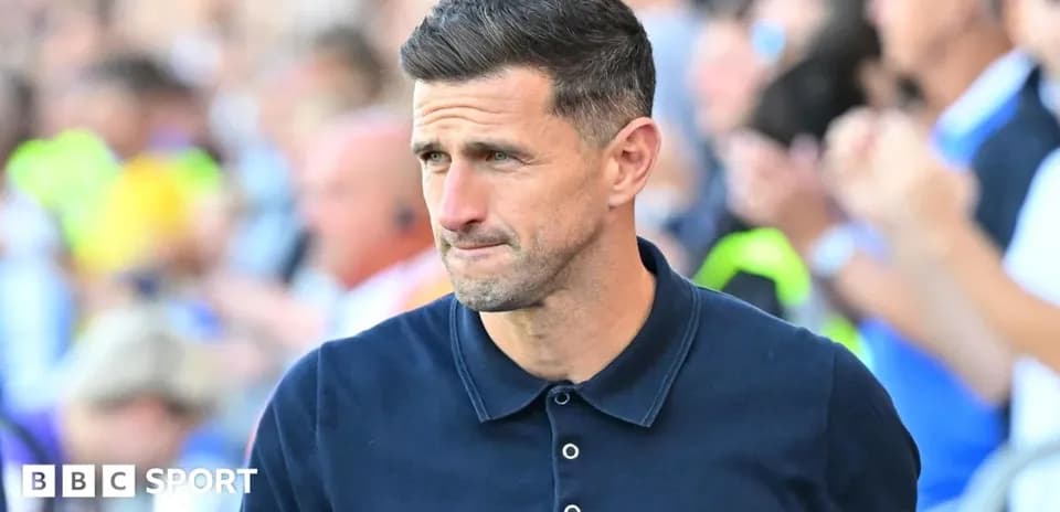 Coach walking on the sidelines during match