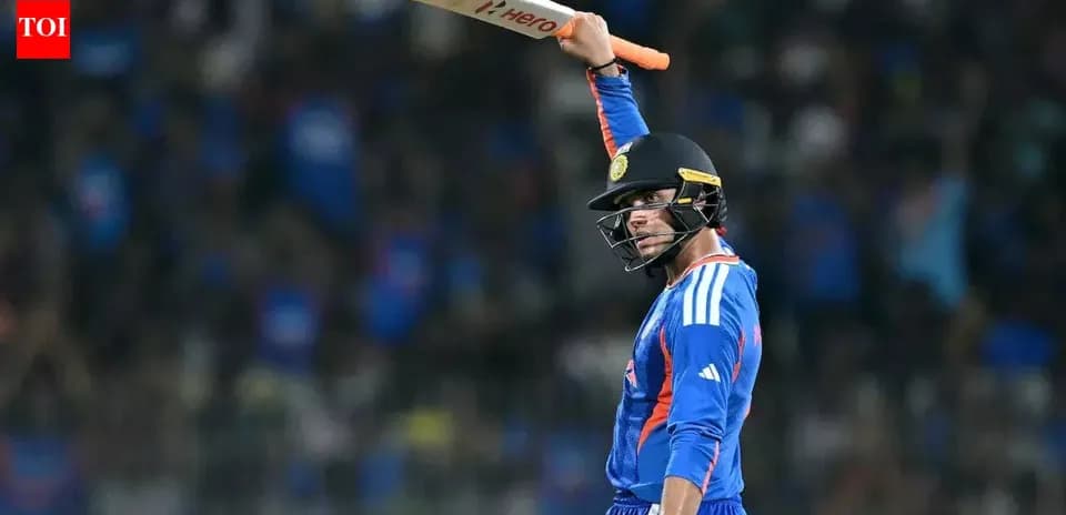 Batsman celebrating with raised bat after scoring runs