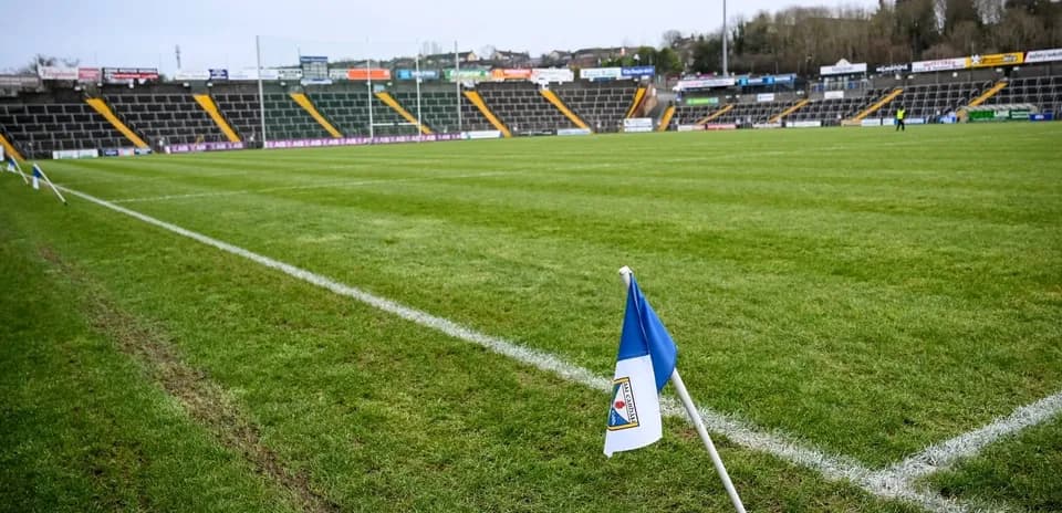 Corner flag at a rugby field with empty stands