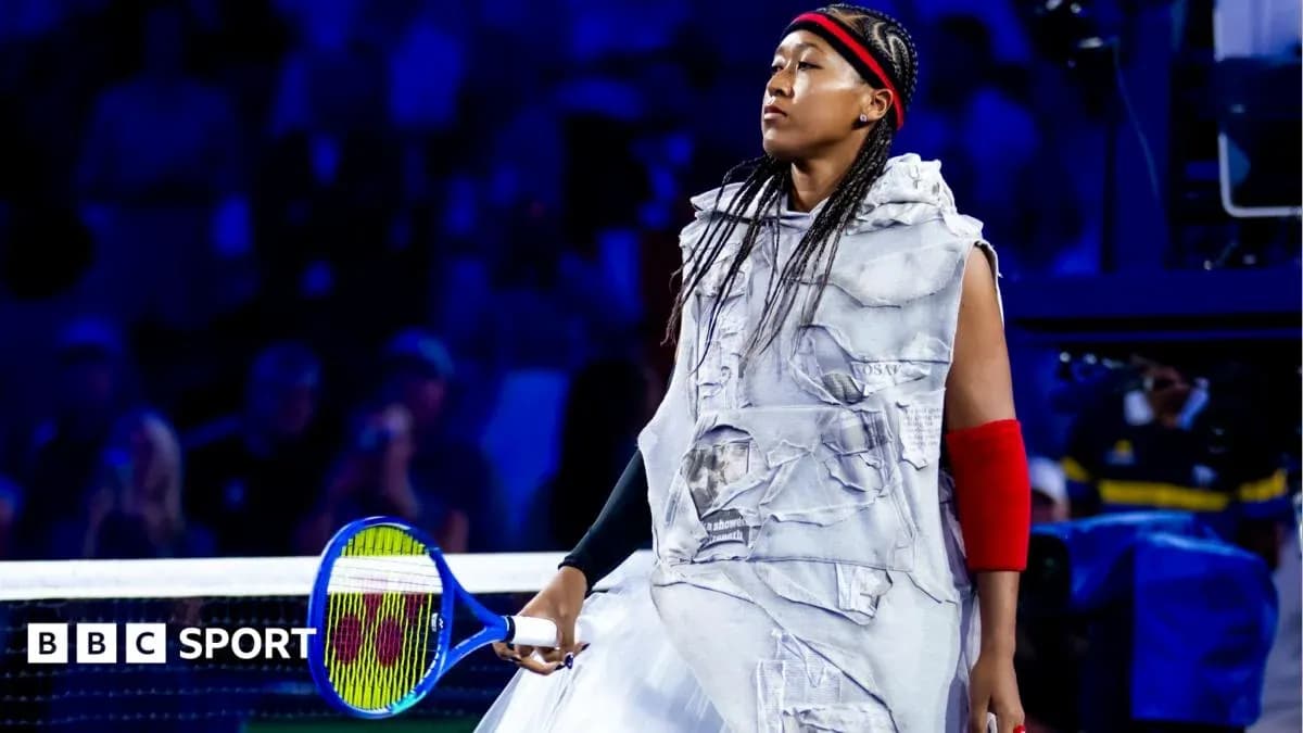Naomi Osaka entering the court with a racket