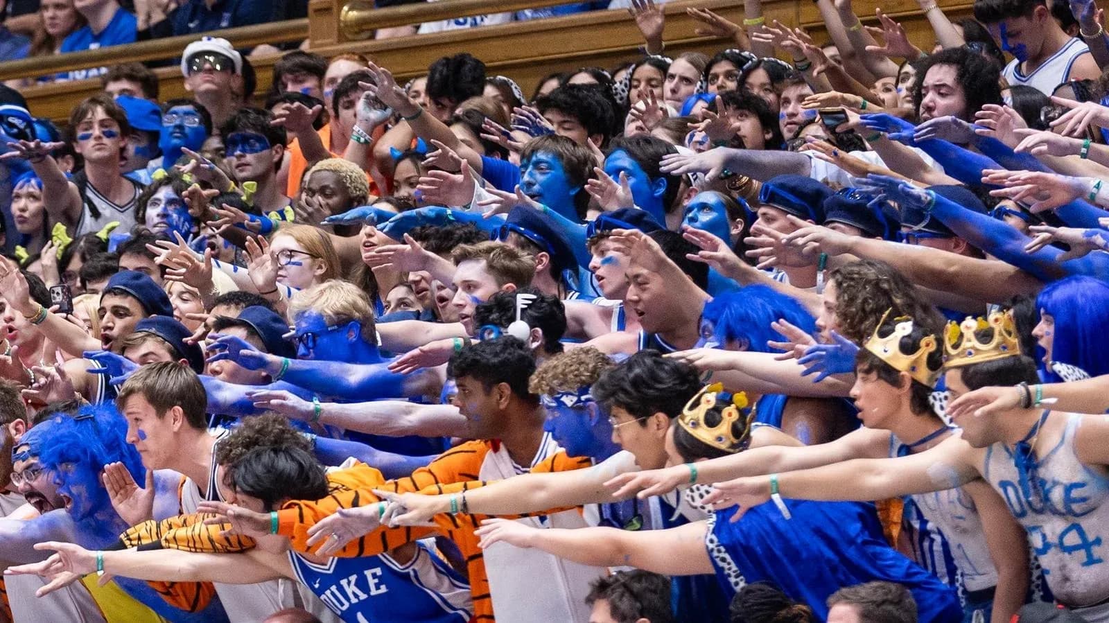 Duke University fans cheering with blue body paint
