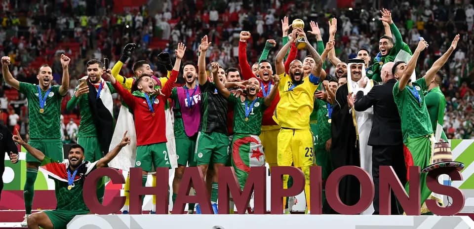Algerian team celebrating FIFA Arab Cup victory