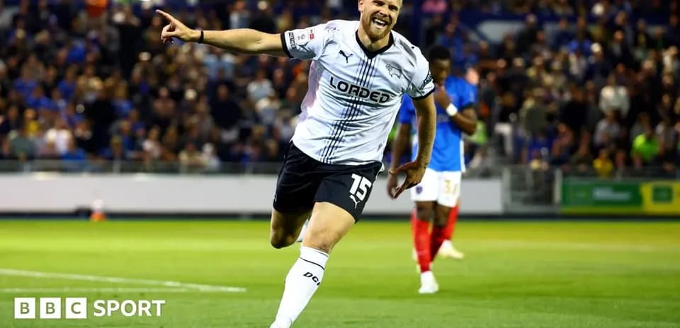 Player celebrating a goal on the pitch