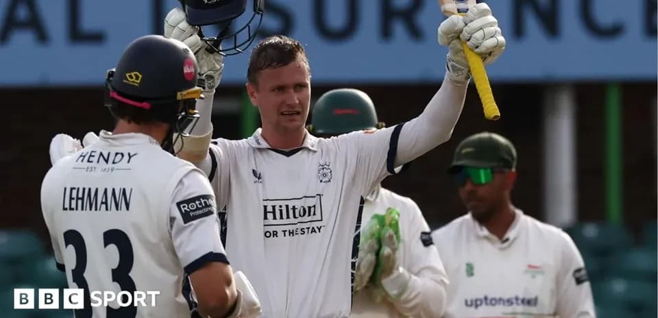 Batsman celebrating after scoring a milestone in cricket