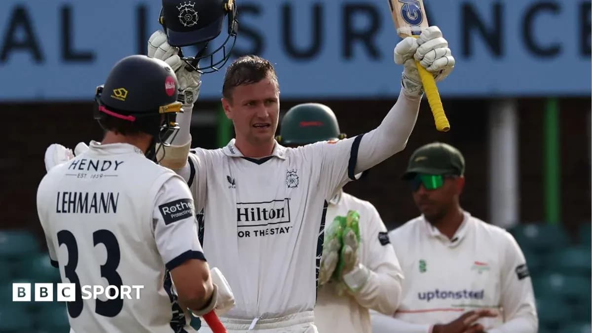 Batsman celebrating after scoring a milestone in cricket
