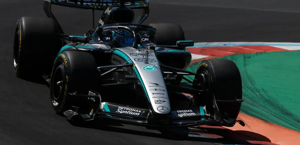 Mercedes F1 car navigating a track corner