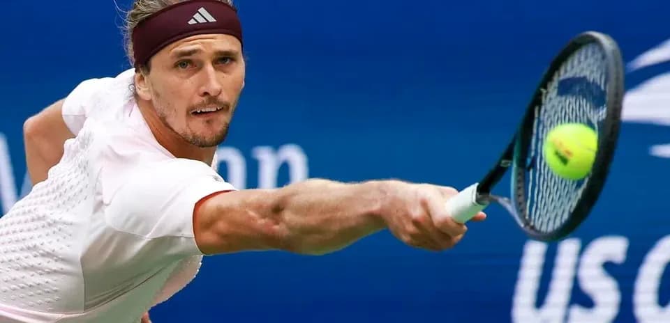 Player hitting a tennis ball during a match