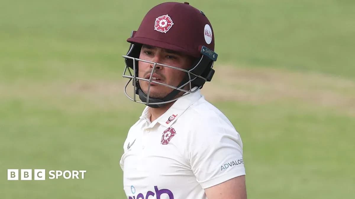 Cricketer wearing helmet during match at the pitch