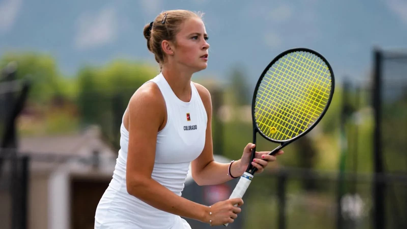 Female tennis player preparing to hit a shot
