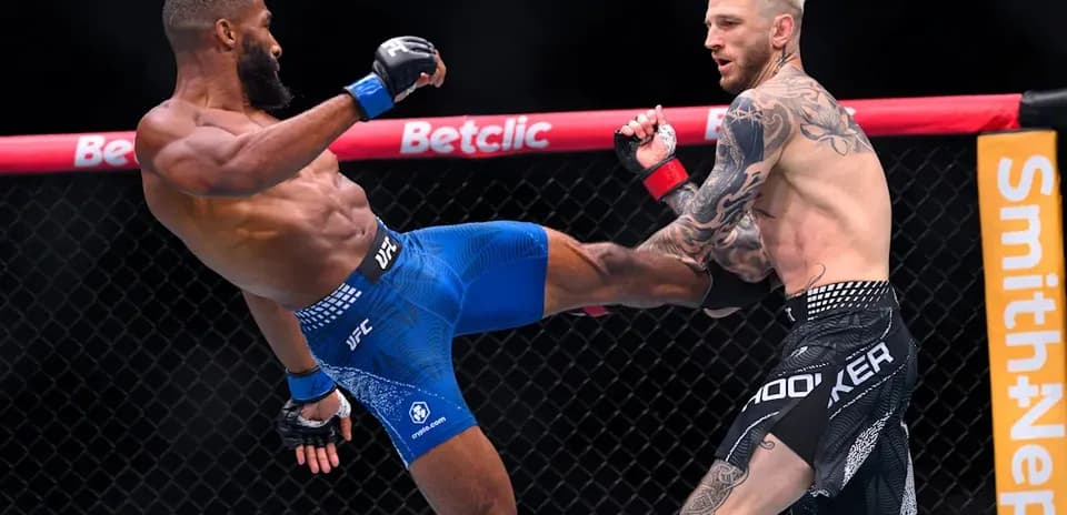 Two fighters engaged in an MMA match