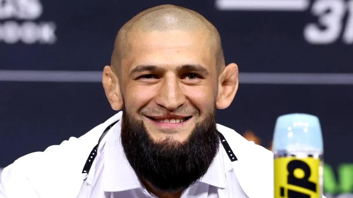 Fighter smiling during press conference appearance