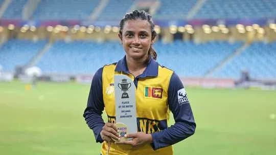 Player holding Player of the Match trophy