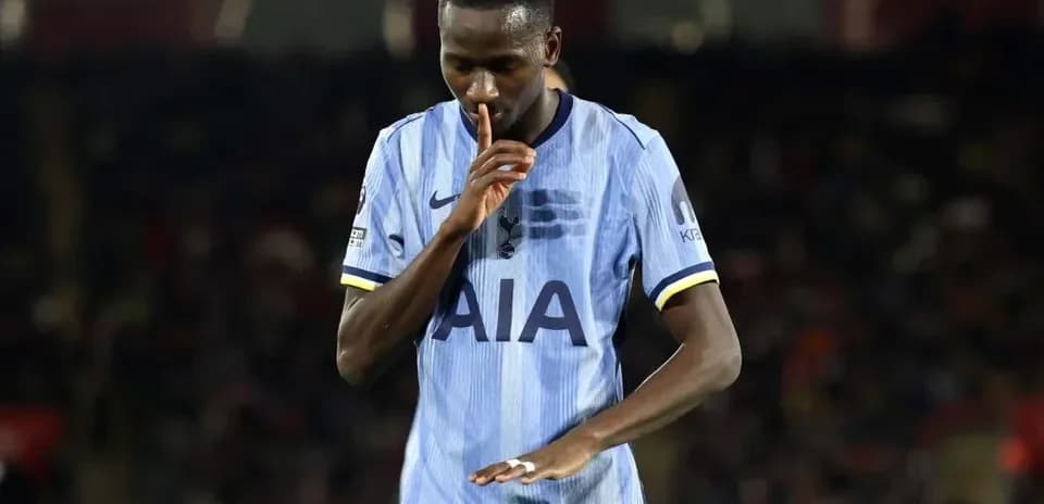 Player gesturing for silence during a match