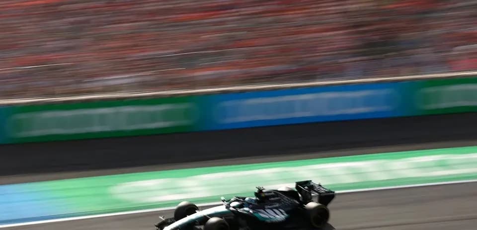 Race car speeding on track with blurred background