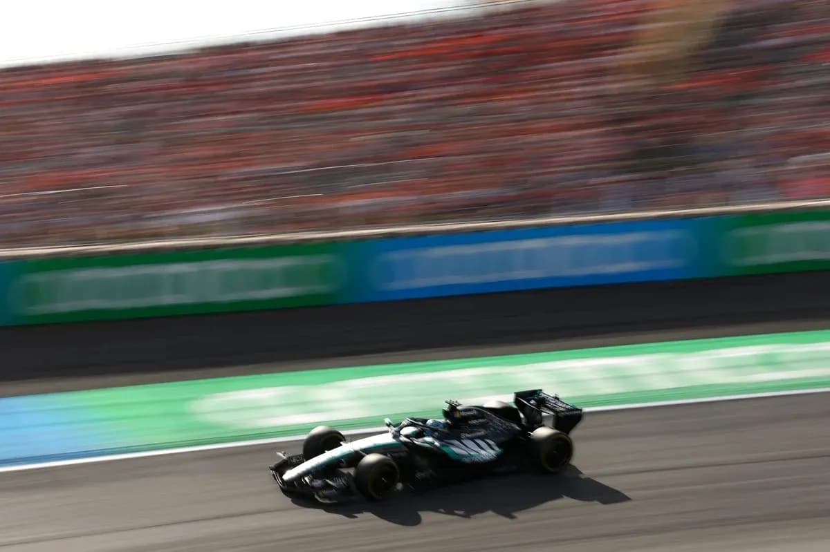 Race car speeding on track with blurred background