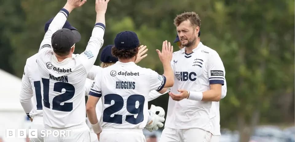 Cricket players celebrating a wicket on field