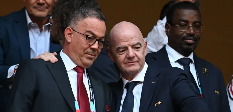 Officials at FIFA event discussing in the stands