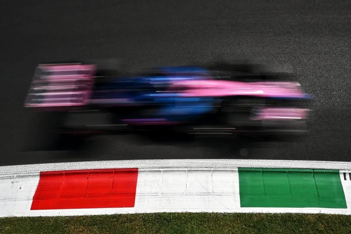 Formula 1 car speeding past track curbing