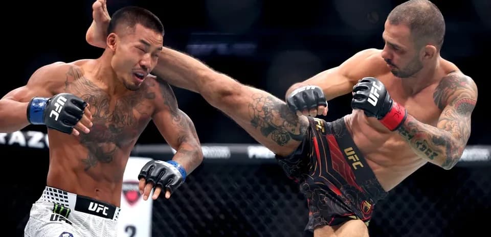 Two fighters engaging in a UFC match action