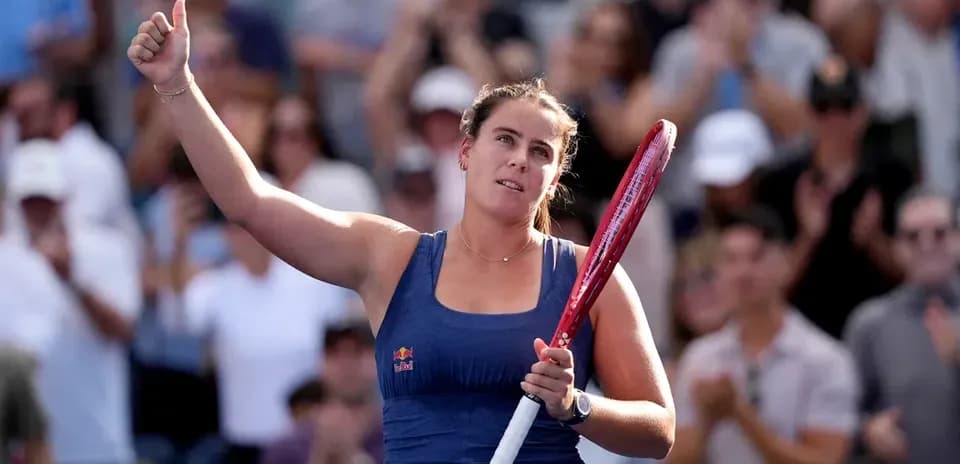 Tennis player acknowledging crowd after match