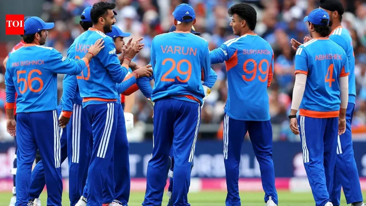 Cricket team celebrating a wicket on the field