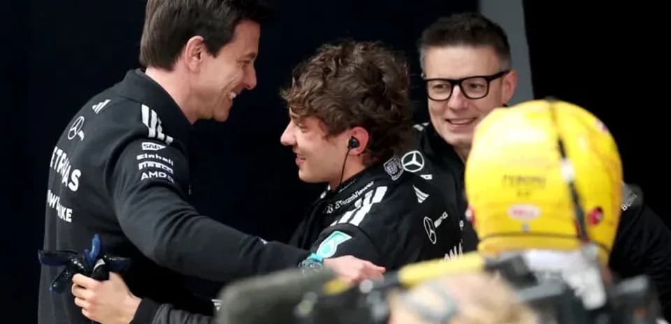 Team members celebrating after a race result