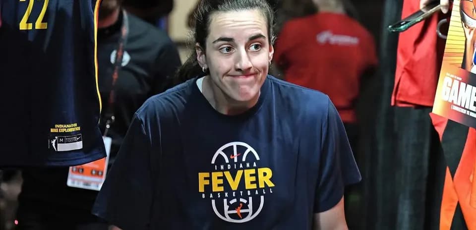 Player walking out in Indiana Fever warm-up shirt