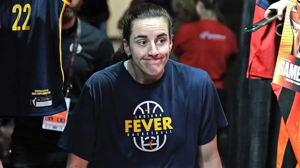 Player walking out in Indiana Fever warm-up shirt