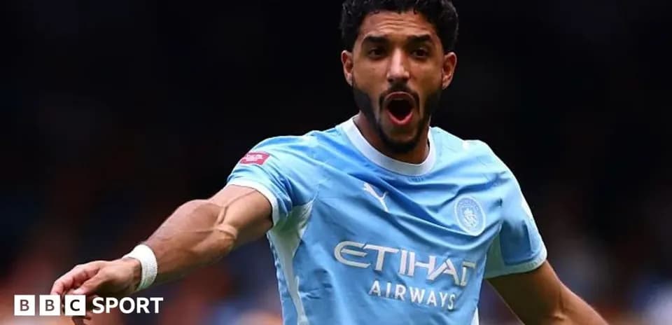 Player celebrating during a match in light blue jersey