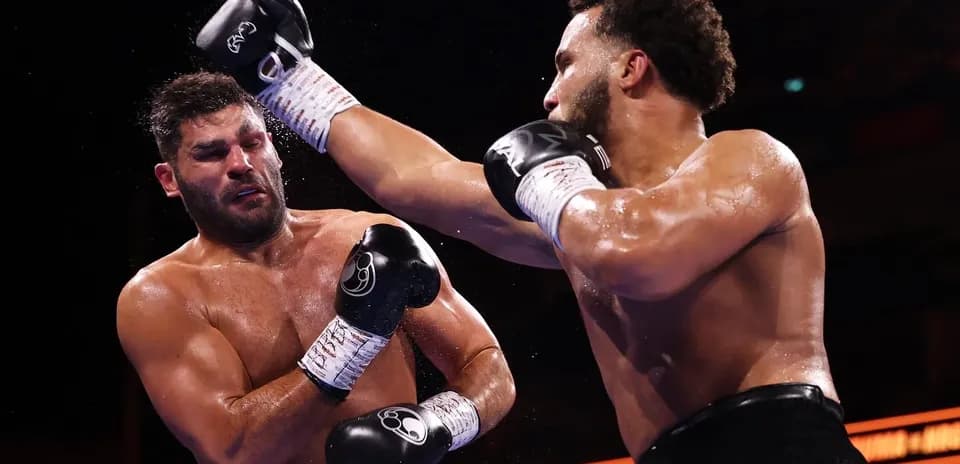 Two boxers exchanging punches in the ring