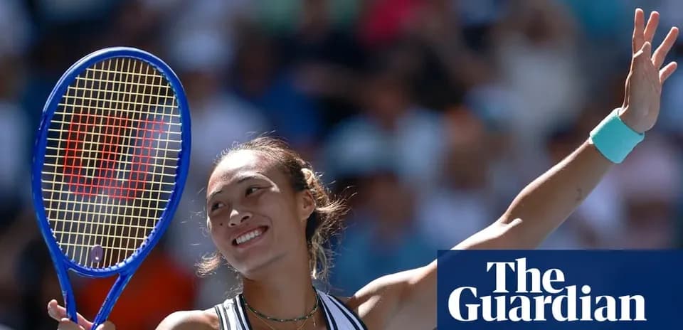 Tennis player celebrating with racket raised after match