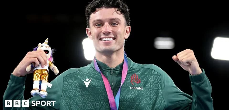 Athlete celebrating with medal and stuffed toy