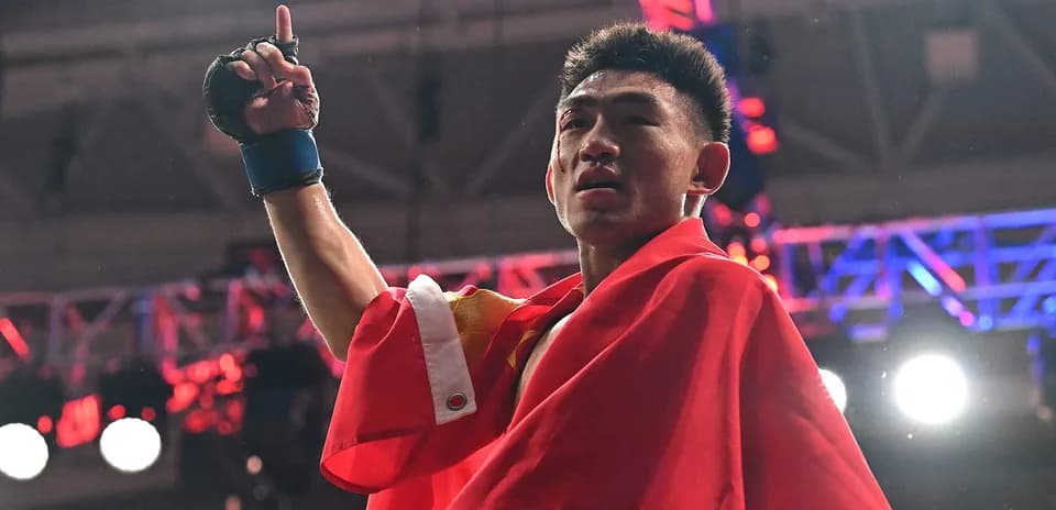 Boxer celebrating victory with raised hand and flag