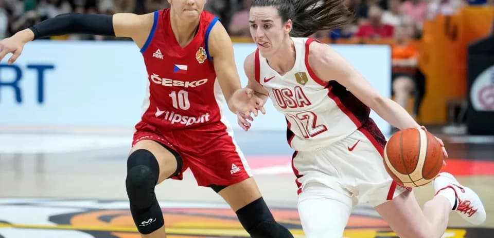 USA player dribbling past Czech player in game