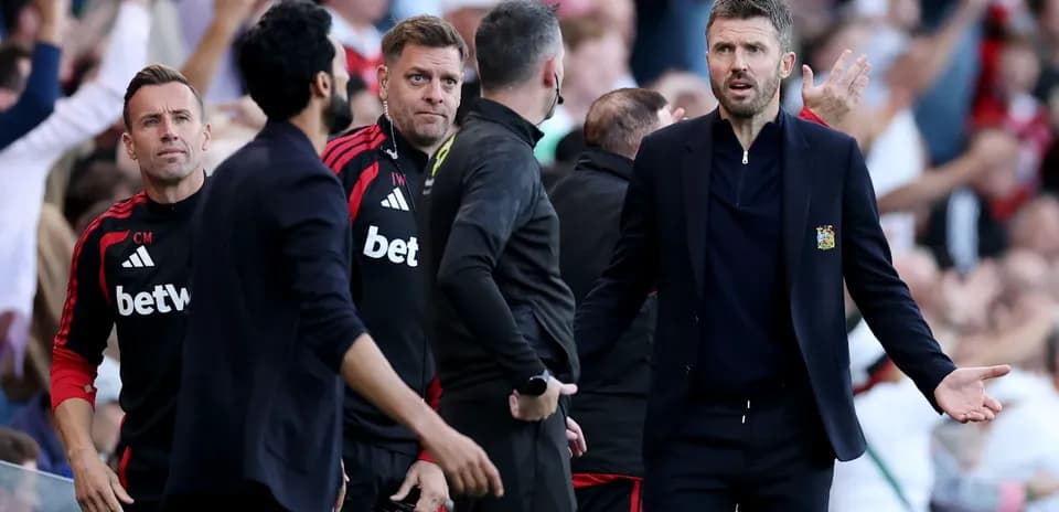 Coaching staff reacting during a tense match situation