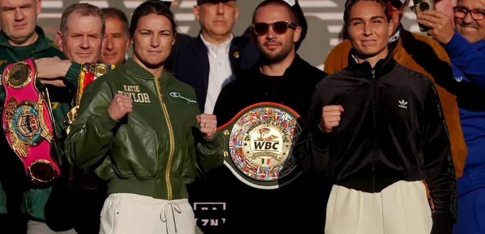 Katie Taylor and opponent posing at weigh-in event