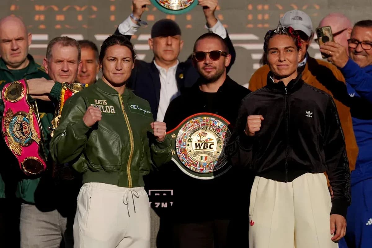 Katie Taylor and opponent posing at weigh-in event