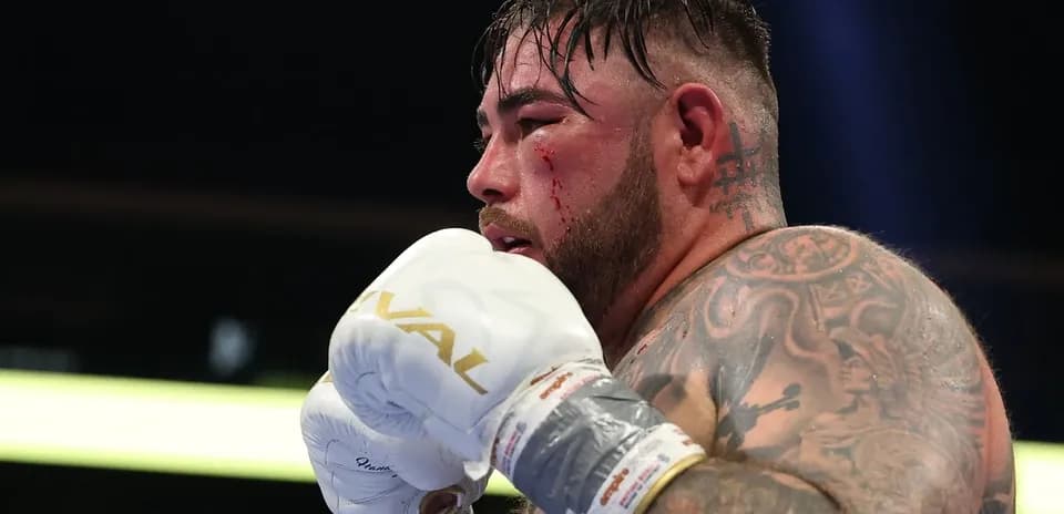 Boxer with blood on face preparing to fight