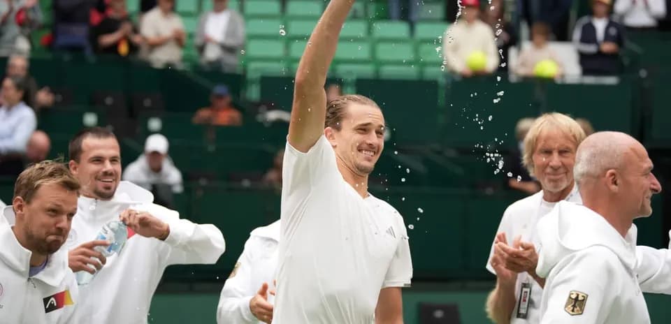 Player celebrating with teammates and water bottle